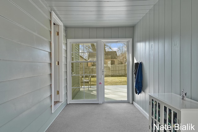 doorway with carpet floors