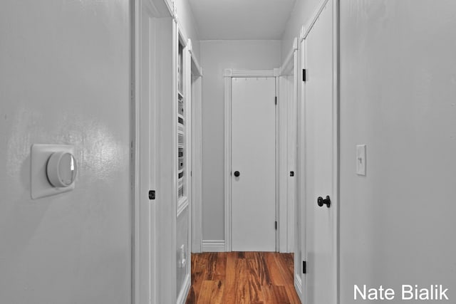 corridor featuring wood finished floors