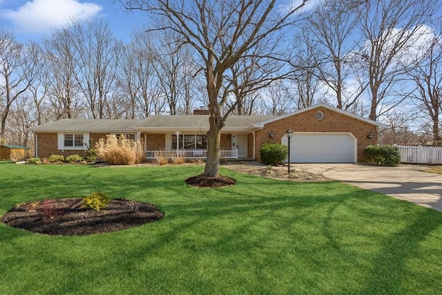 single story home with a front yard, fence, an attached garage, concrete driveway, and brick siding