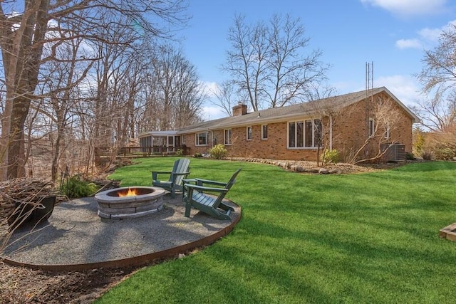 view of yard with a fire pit