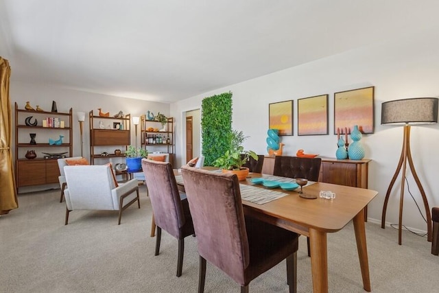 dining space with light carpet