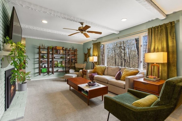 carpeted living room featuring beam ceiling, recessed lighting, a brick fireplace, and ceiling fan