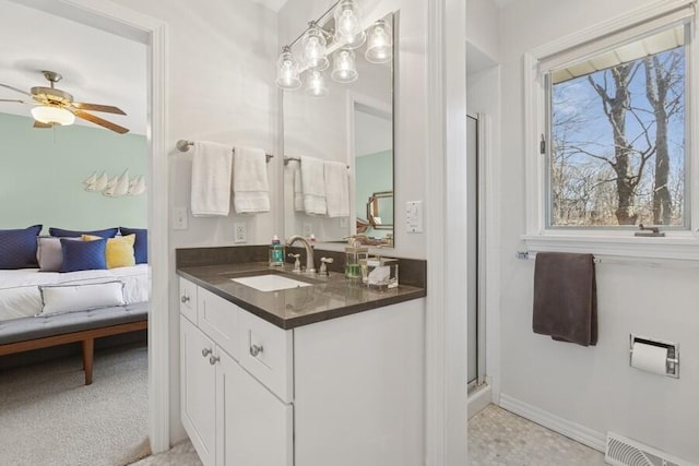 bathroom featuring vanity, a shower with shower door, visible vents, ceiling fan, and connected bathroom