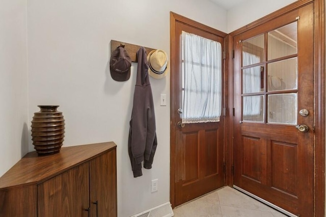 doorway featuring light tile patterned floors