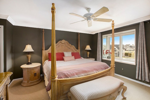 bedroom with crown molding, carpet flooring, a ceiling fan, and baseboards