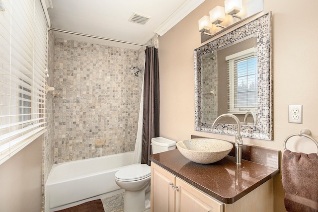 bathroom featuring visible vents, shower / tub combo with curtain, toilet, crown molding, and vanity