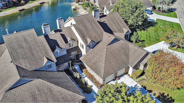 bird's eye view featuring a residential view and a water view