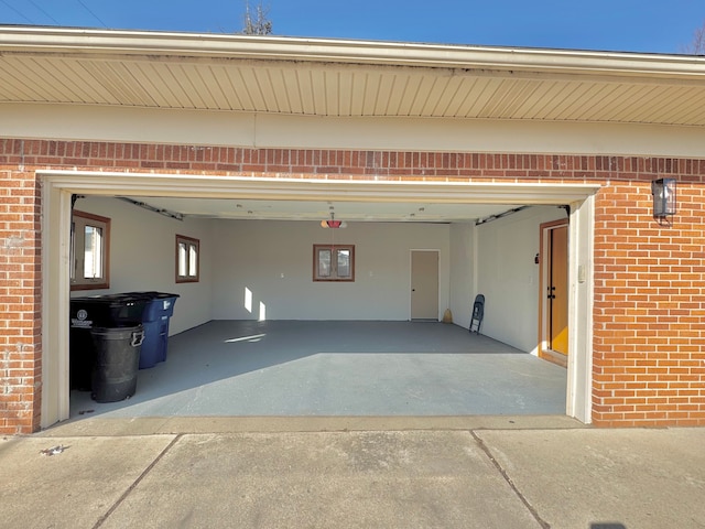 garage with concrete driveway