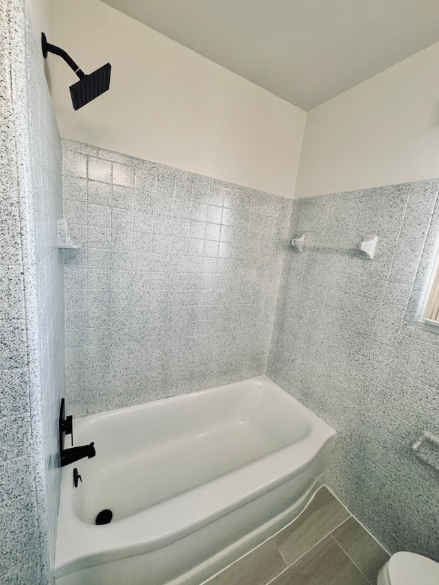 full bathroom featuring shower / bathing tub combination and toilet