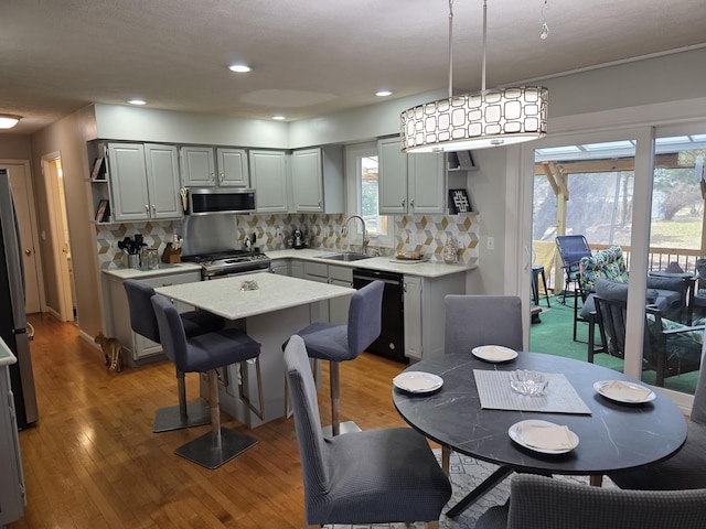 dining area with recessed lighting and light wood-type flooring