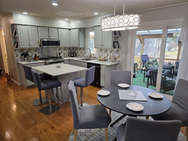 dining area with recessed lighting and light wood-type flooring