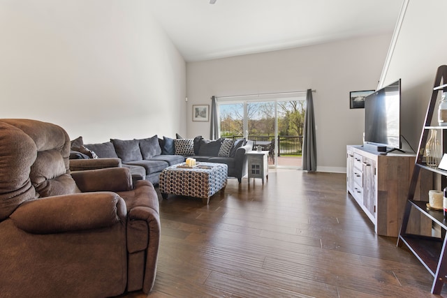 living area with baseboards and dark wood-style flooring