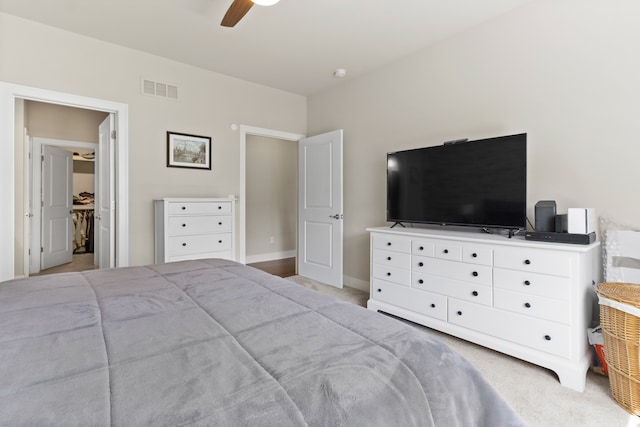 bedroom featuring baseboards, visible vents, carpet floors, and ceiling fan