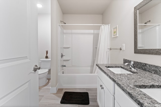 full bath with shower / bath combo with shower curtain, toilet, and vanity