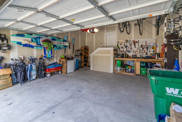 garage featuring a workshop area and a garage door opener