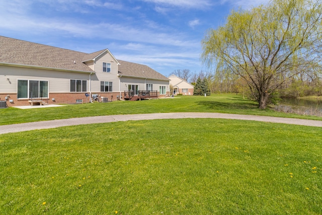 view of yard featuring a wooden deck