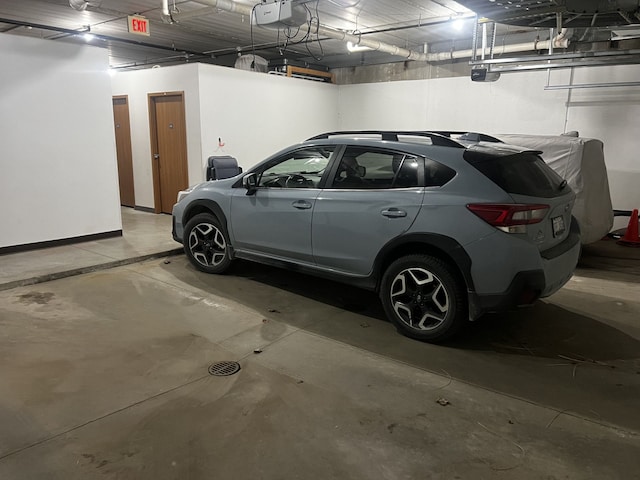 parking deck featuring a garage door opener