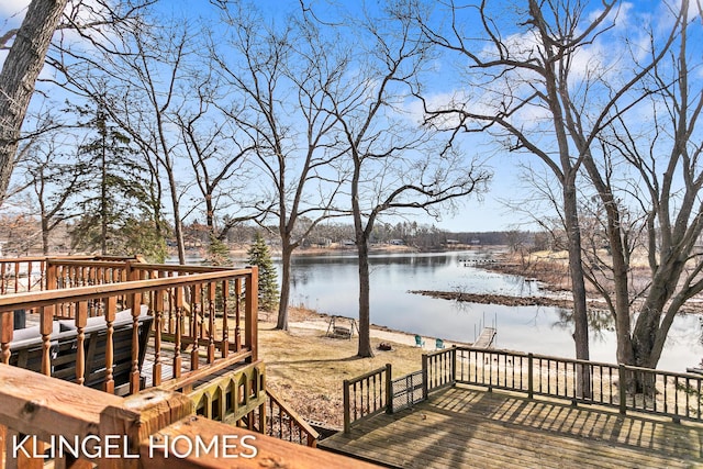 wooden deck with a water view