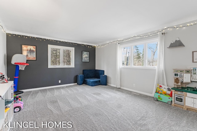 playroom with carpet flooring and baseboards