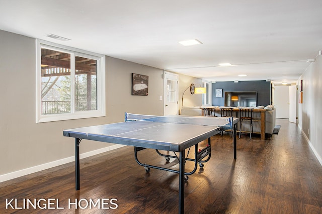 playroom featuring visible vents, baseboards, and wood finished floors