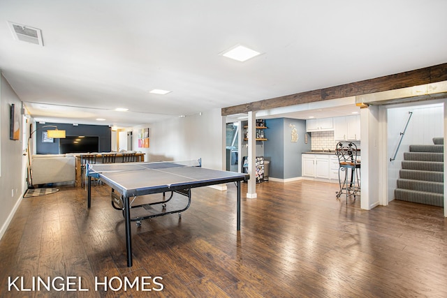 rec room with hardwood / wood-style floors, baseboards, and visible vents