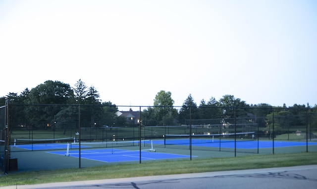 view of sport court featuring fence