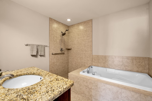 full bath with vanity, a bath, recessed lighting, and a tile shower