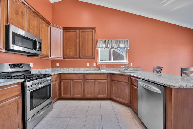 kitchen with ornamental molding, appliances with stainless steel finishes, a peninsula, brown cabinetry, and a sink