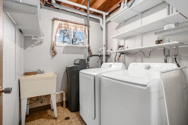 clothes washing area with washer and dryer and laundry area