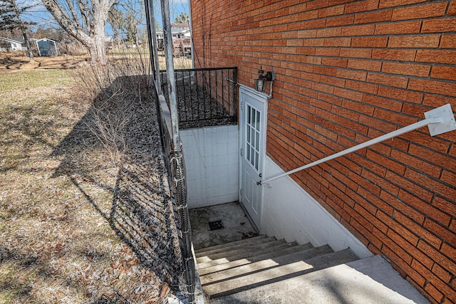 entrance to property with brick siding