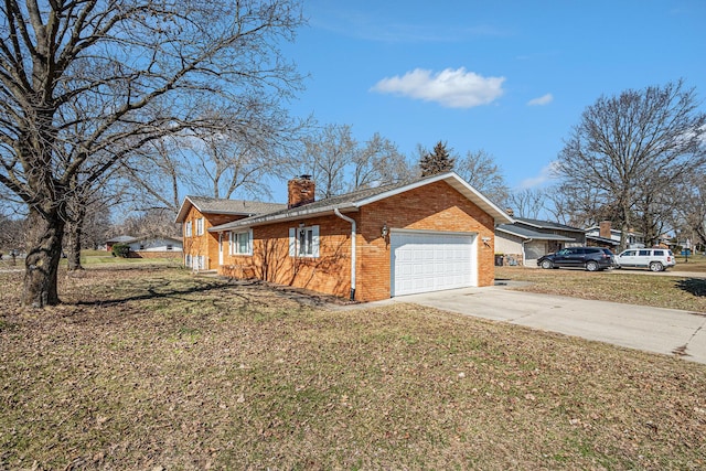 view of property exterior featuring brick siding, a lawn, a chimney, driveway, and an attached garage
