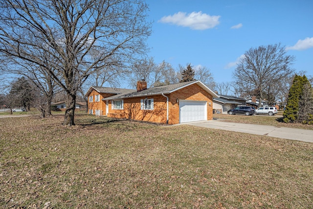 view of front facade featuring a front yard, a chimney, concrete driveway, a garage, and brick siding