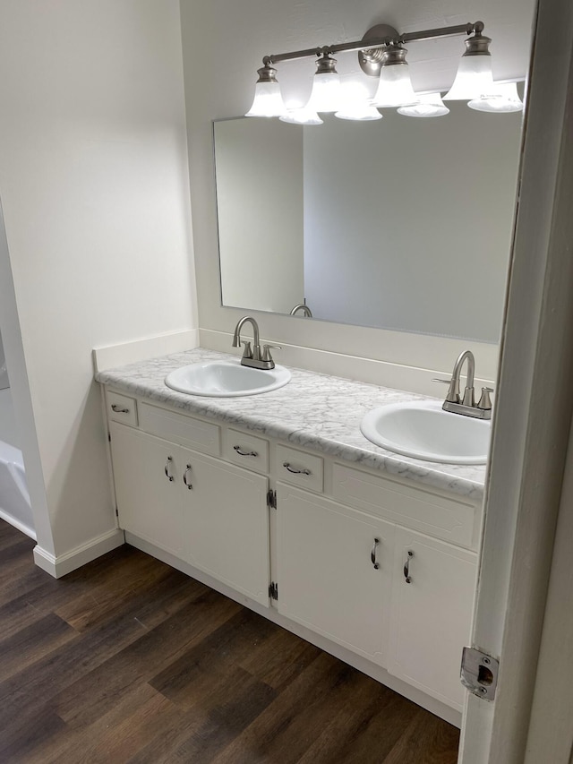 4737 Dogwood Dr, Berrien Springs, MI 49103 - full bathroom with double vanity and wood finished floors