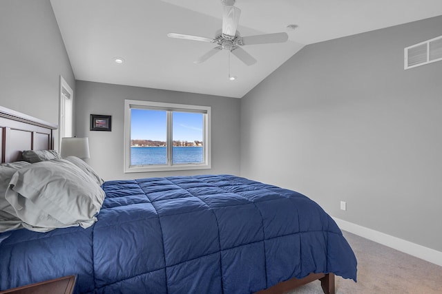 bedroom with visible vents, baseboards, carpet, lofted ceiling, and a ceiling fan