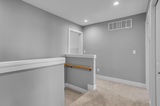 hall featuring visible vents, recessed lighting, baseboards, and carpet