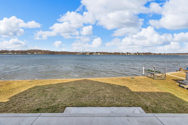 property view of water with a dock