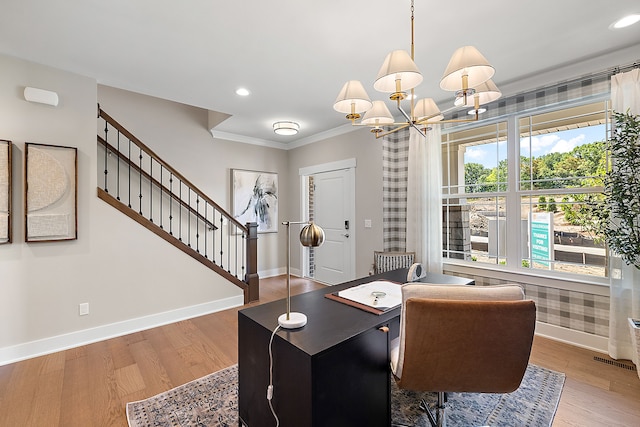 home office with a chandelier, baseboards, and wood finished floors