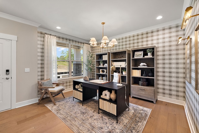 office area featuring baseboards, wallpapered walls, crown molding, and an inviting chandelier