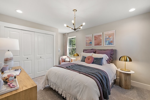 carpeted bedroom with recessed lighting, a notable chandelier, baseboards, and a closet