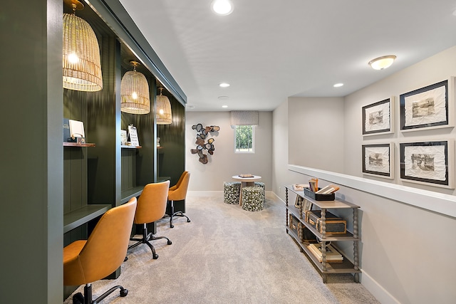 carpeted office space with recessed lighting, baseboards, and built in study area