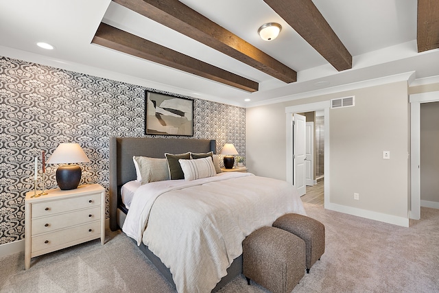 bedroom featuring visible vents, wallpapered walls, baseboards, beamed ceiling, and light colored carpet