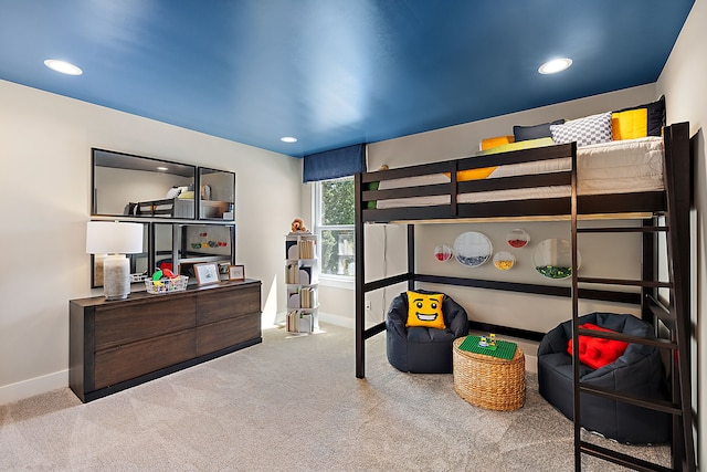 carpeted bedroom featuring recessed lighting and baseboards