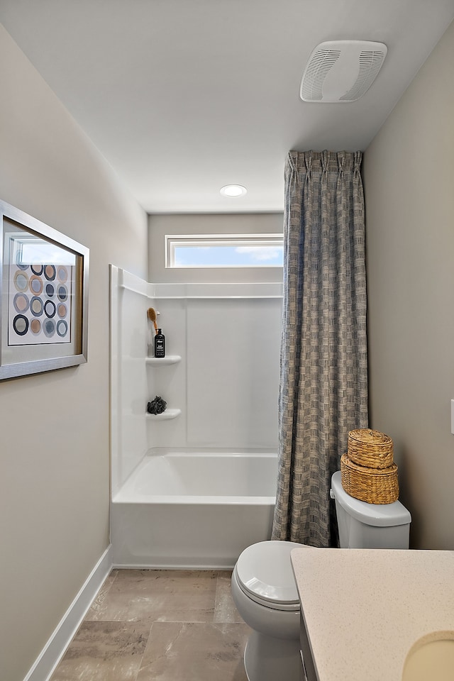 bathroom featuring visible vents, baseboards, shower / bath combo with shower curtain, toilet, and vanity