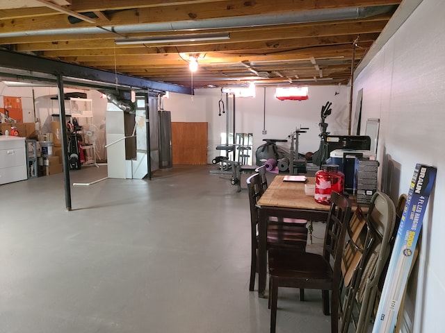 unfinished basement featuring washer / dryer