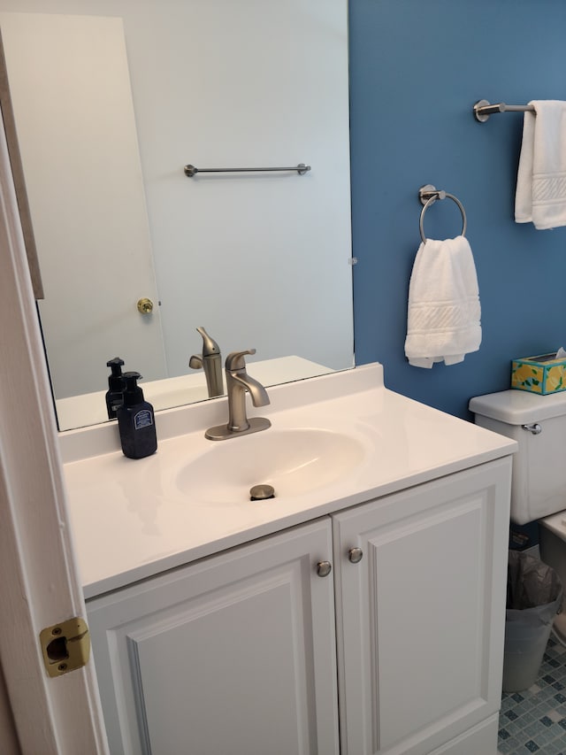 bathroom featuring toilet and vanity