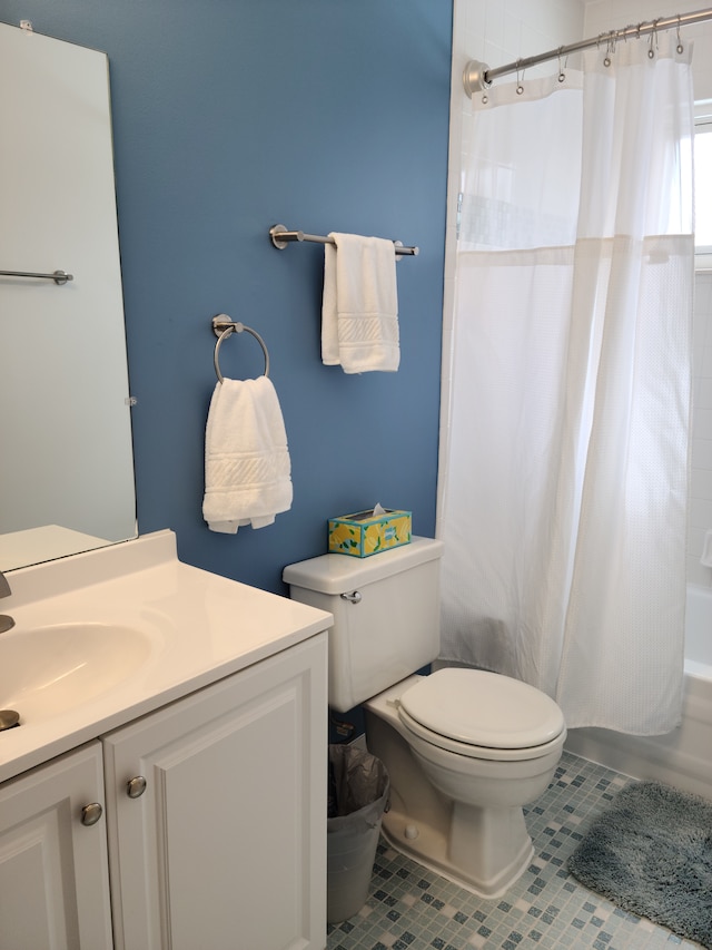 full bath with vanity, tile patterned floors, shower / tub combo, and toilet