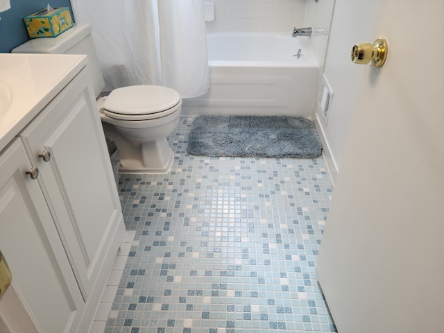 bathroom with tile patterned flooring, toilet, vanity, and visible vents