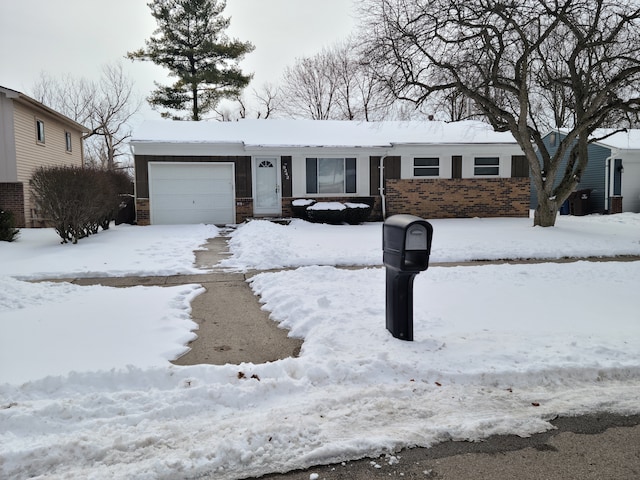 ranch-style house featuring brick siding and an attached garage