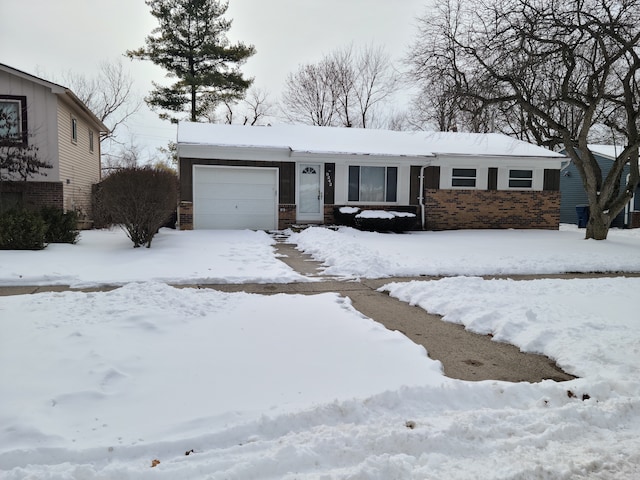 view of front of house with brick siding and an attached garage