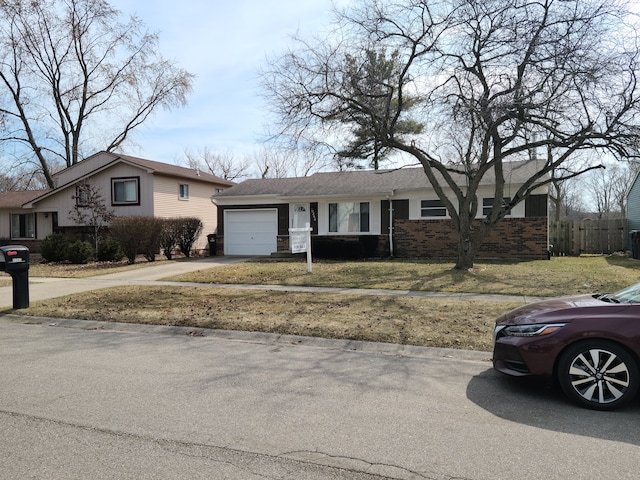 view of front facade featuring brick siding, concrete driveway, and an attached garage